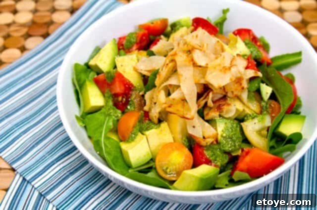 Salad Bowl Top View Overhead view of a beautiful Heirloom Tomato and Avocado Salad in a bowl