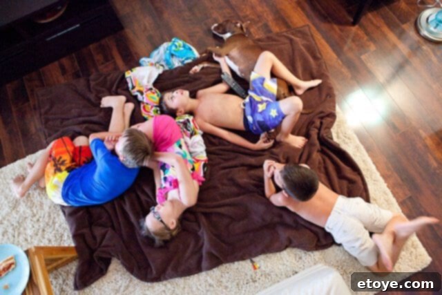 Nathan hugging Ms. Brooke tightly, showing his sadness at her departure.