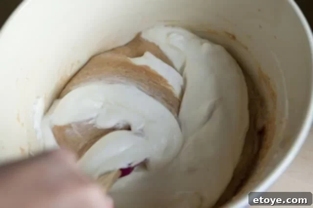Peanut Butter Pie Filling The creamy peanut butter filling is poured into the prepared chocolate crust, ready to be smoothed.