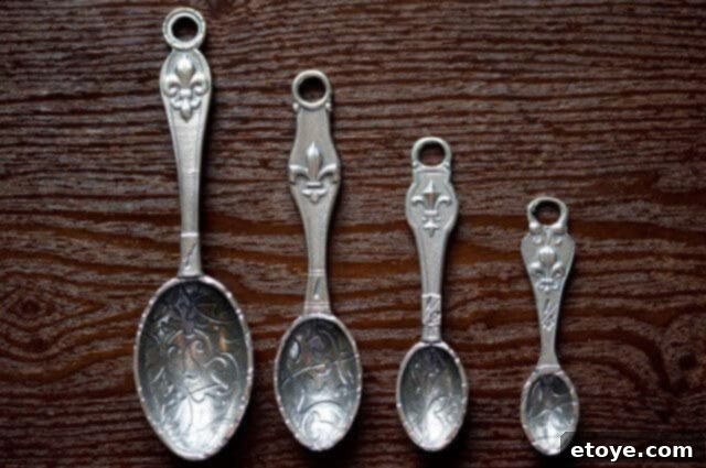 Elegant Fleur de Lys Pewter Measuring Spoons with Display Stand