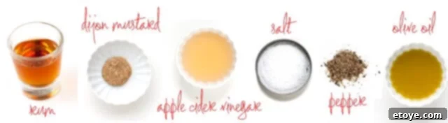 Ingredients for making a homemade Rum Vinaigrette: aged rum, olive oil, apple cider vinegar, Dijon mustard