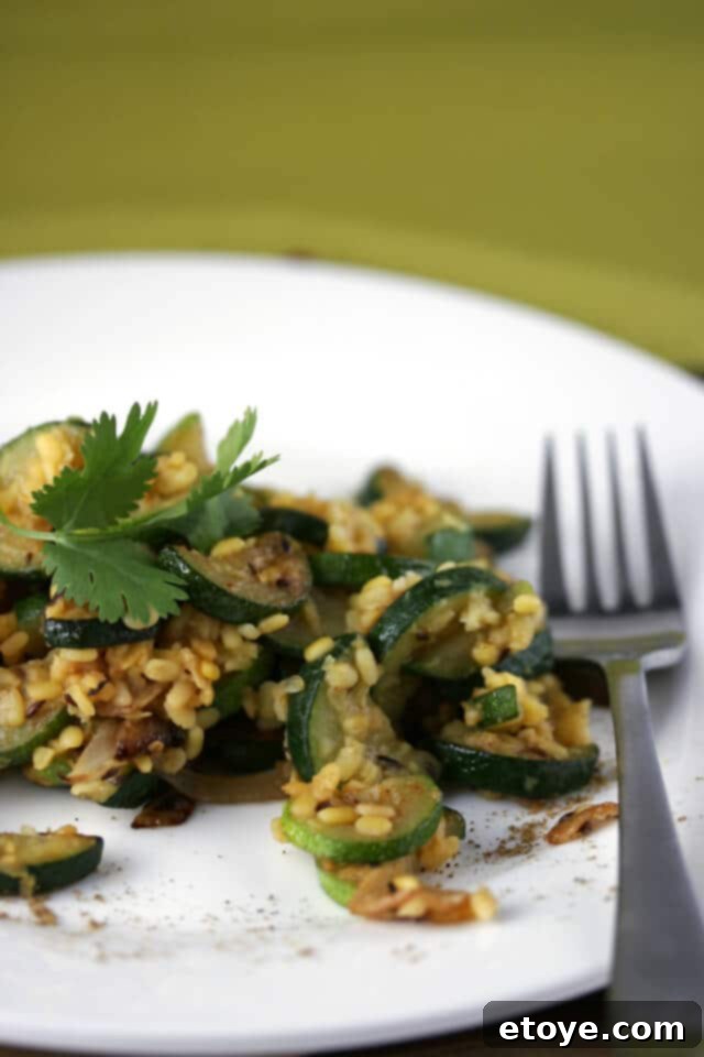 Close-up of Zucchini with Lentils and Roasted Garlic in a serving bowl, ready to be enjoyed.
