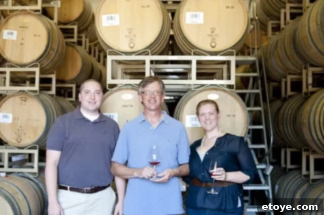 Adam, Joanne, and Greg at Erath Winery with scenic background