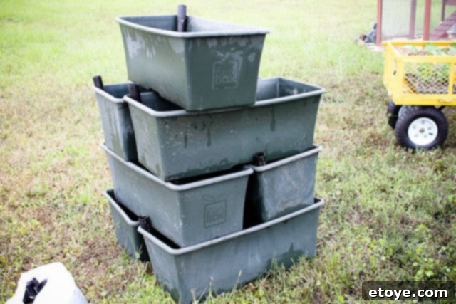 Smart Gardening with Earthboxes 5 Gardeners preparing soil for an EarthBox, demonstrating the initial setup