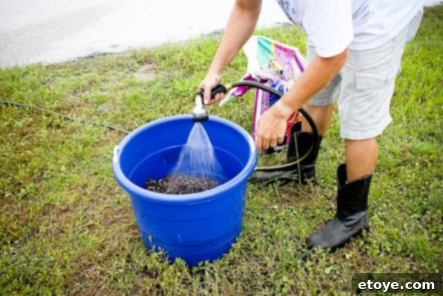 Smart Gardening with Earthboxes 6 Moistening potting mix in a bucket, ready for EarthBox setup