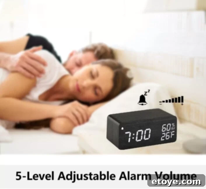 Sleek digital alarm clock with wireless charging pad and wooden finish