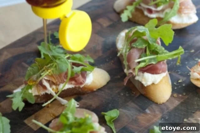 Topping Crostinis with Prosciutto, Arugula, and Honey