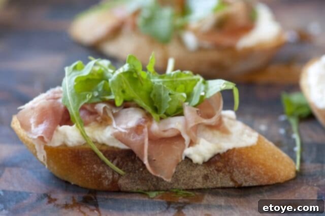 Plated Prosciutto and Ricotta Crostinis with Honey