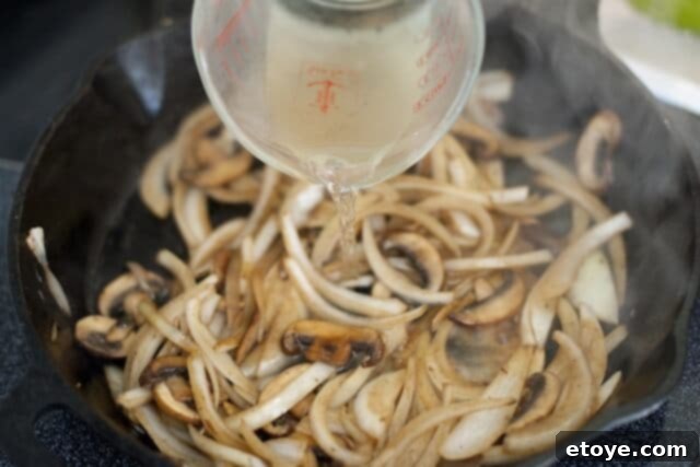 Adding Dry White Wine to the Pan