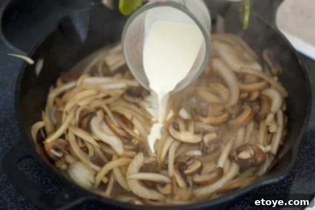 Adding Heavy Cream to the White Wine Sauce