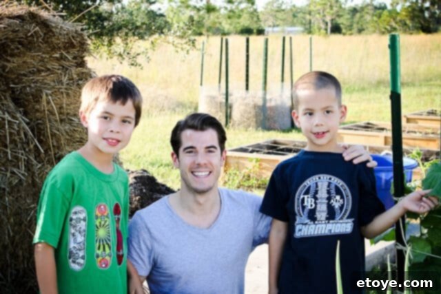 John Gregory Smith standing happily with the author in a kitchen setting