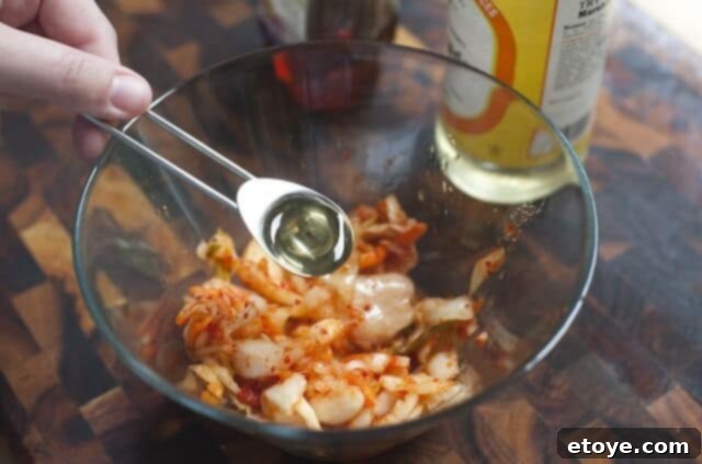 Kimchi Relish Ingredients Ingredients for kimchi relish: kimchi, honey, and rice vinegar in separate bowls