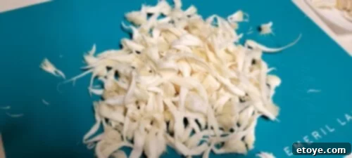 Hand-shredded Lion's Mane mushroom, resembling crab meat