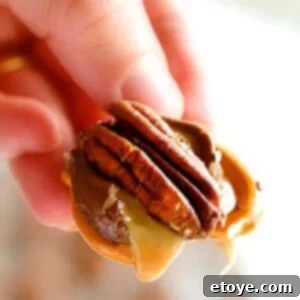 Salty Sweet Rolo Pretzel Clusters 2 Close-up of a Rolo Pretzel Turtle with a nut on top