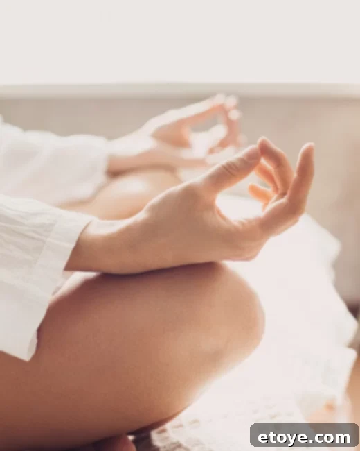 Person meditating peacefully, demonstrating relaxation and calm