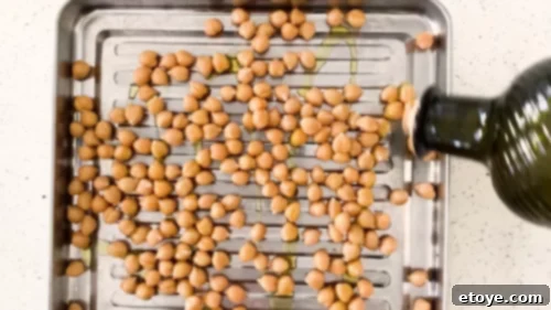 Vibrant Seared Salmon Salad with Crispy Chickpeas and Zesty Strawberry Vinaigrette 8 Roasted garbanzo beans in a bowl