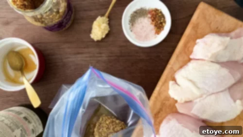 Wholesome Honey Mustard Chicken with Golden Quinoa Pilaf 4 Marinating chicken breasts with honey mustard sauce