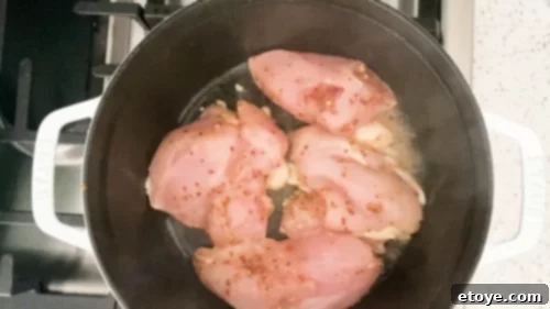 Wholesome Honey Mustard Chicken with Golden Quinoa Pilaf 5 Searing honey mustard chicken in a hot pan