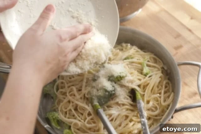 Rich Miso Chicken Pasta 10 Cooked chicken pieces added to the pasta, broccoli, and sauce mixture in the skillet, ready to be tossed.