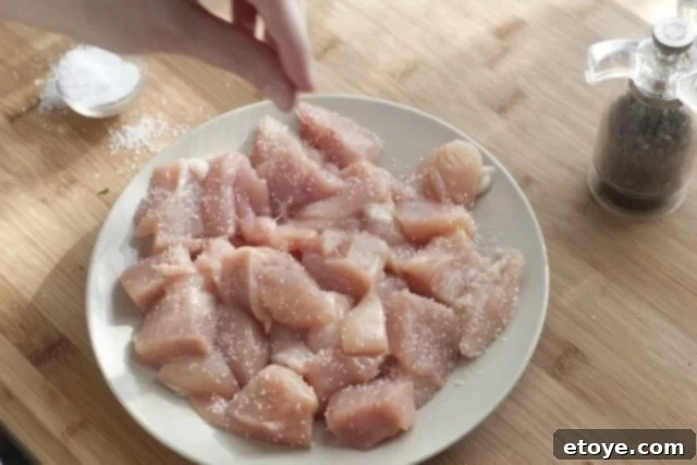 Rich Miso Chicken Pasta 5 Chicken pieces sizzling and browning in a large skillet with olive oil over medium-high heat.