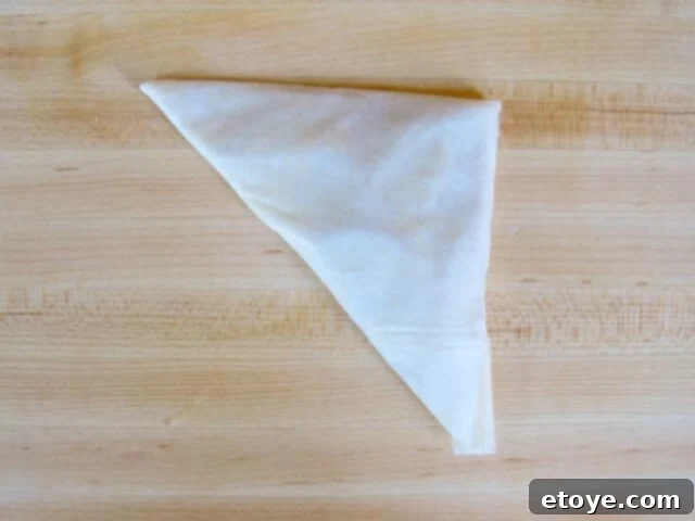 Finished Folded Boureka Completed triangular boureka, neatly folded