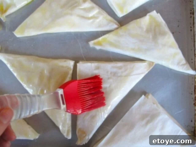 Butter Topping Brushing the tops of unbaked bourekas with melted butter