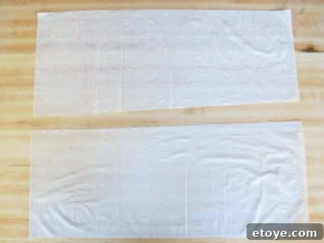 Cutting Filo Sheets Two rectangular pieces of filo dough, cut for bourekas