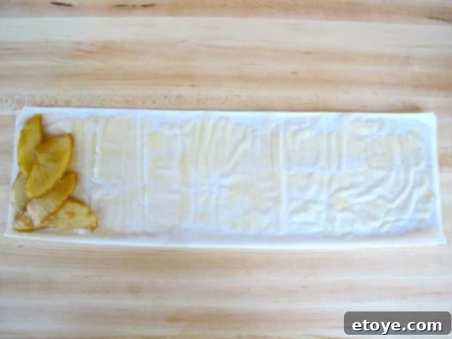 Filling the Filo Apple filling placed on the corner of a filo strip