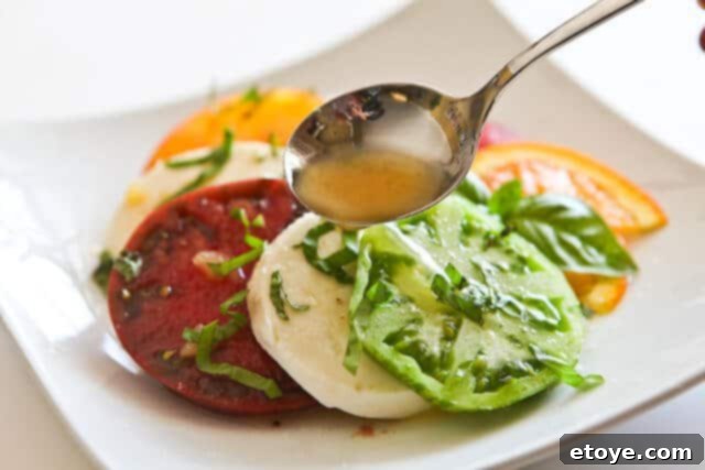 Asian orange vinaigrette generously drizzled over a fresh, vibrant green salad