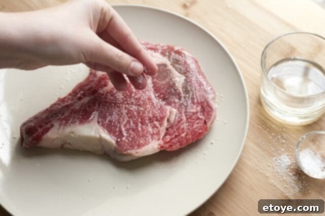 Orange Miso Steak Cooking Rubbing steak with oil and seasoning with salt