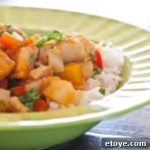 Completed dish of Salt Cod (Bacalao) with Potatoes over Rice, garnished with fresh parsley