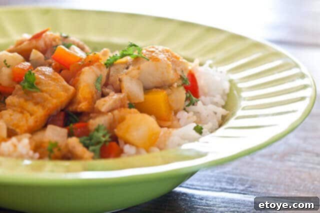 Delicious Bacalao stew served over a bed of rice, ready to be enjoyed