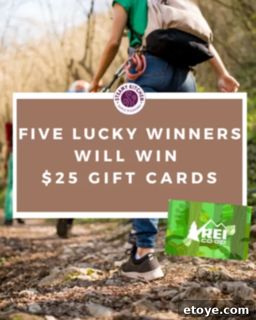 Win Your Outdoor Oasis 3 Outdoor gear display with hiking boots, backpacks, and water bottles at REI