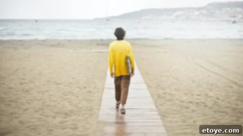 A person walking alone on a path, symbolizing an individual journey without comparison