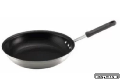Skillet Close-up of Farberware Restaurant Pro 12-Inch Open Skillet featuring Teflon Platinum nonstick interior