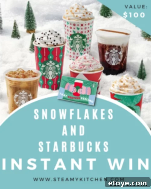 A warm Starbucks coffee cup nestled in a snowy winter scene, inviting warmth and comfort.