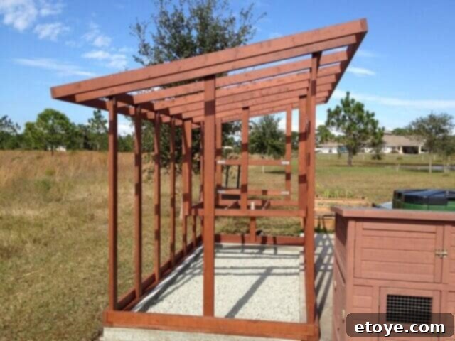 Chicken Coop Kick Plate Installation Chicken coop framing showing kick plates secured to the concrete foundation.