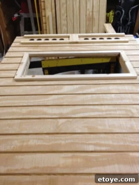 Coop Side Siding Side view of the chicken coop with additional siding panels installed.