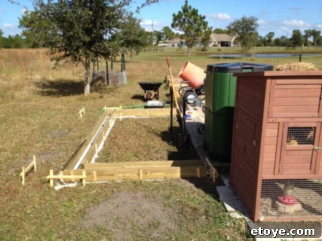 Chicken Coop Foundation Reinforcement Concrete footer for the chicken coop with rebar and drainage elements in place before pouring.