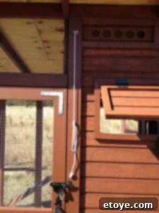 Door Cleat Detail Cleat installed on the chicken coop frame for holding the door open.