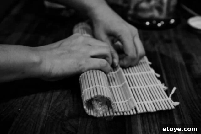 Fiery Kimchi Butter Steak 8 A perfectly formed kimchi butter log, tightly rolled within plastic wrap on a sushi mat.