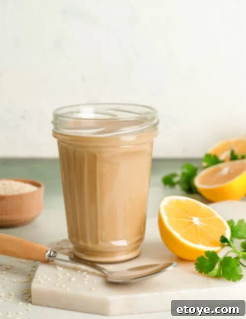 Lemon Tahini Sauce in a glass jar