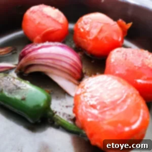 Fire-Kissed Tomato Salsa 7 A vibrant bowl of Charred Tomato Salsa ready to be enjoyed, showcasing its rich texture and color.