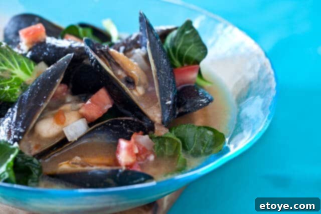 Spicy Miso Steamed Mussels 2 Stack of delicate bowls in a photography studio