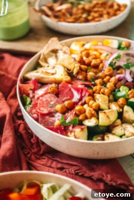 Classic Italian Chopped Salad 3 Italian Chopped Salad in a white bowl with a red table cloth background from a different angle