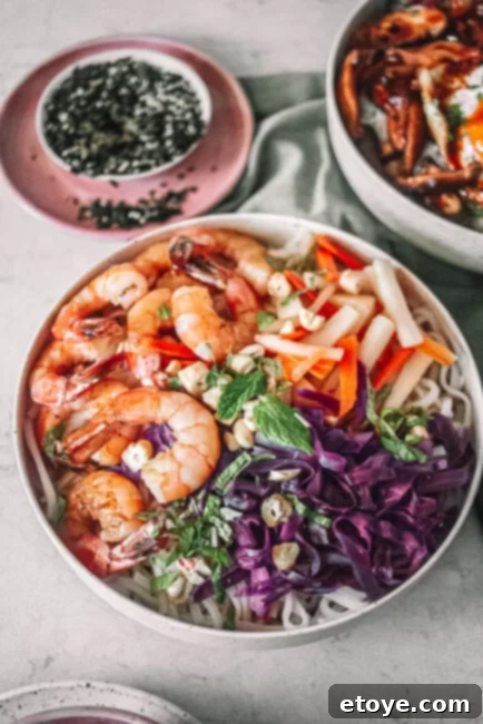 Top View of the Vietnamese Shrimp Noodle Bowl with side dishes
