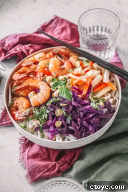Vietnamese Shrimp Noodle Bowl with chopsticks and water