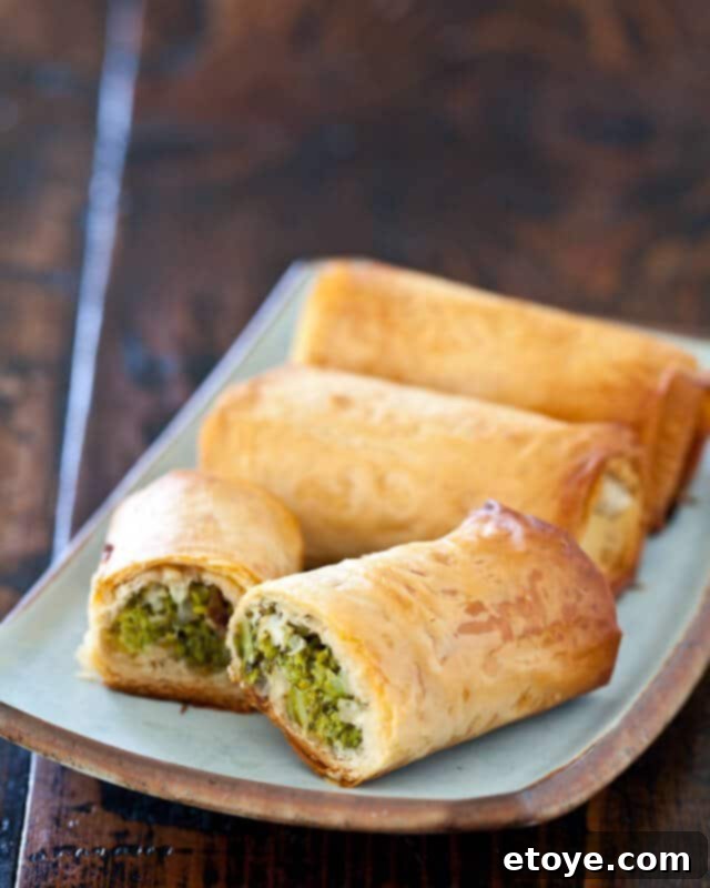 Broccoli Spanakopita Recipe Delicious Homemade Broccoli Spanakopita Rolls on a Baking Sheet