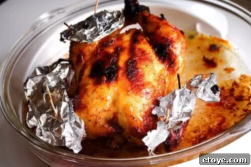 Roasted Chicken Roast Chicken with tin foil and toothpicks strategically placed to prevent burning