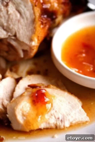 Sweet Plum Glazed Roast Chicken 2 Close-up view of a perfectly cooked Roast Chicken with Sweet Plum Sauce, showing crispy skin and tender meat